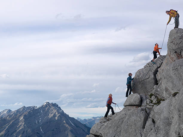 Team climbing a mountain